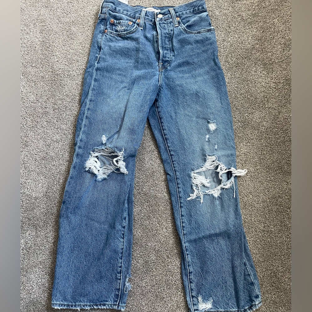 Levi’s distressed medium wash straight leg jeans